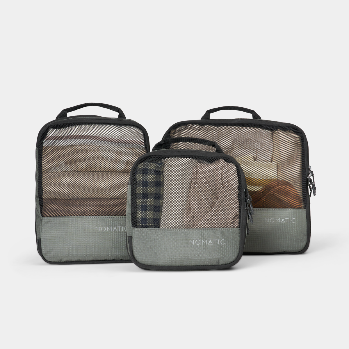 NOMATIC Compression Packing Cubes in moss, set of three shown together